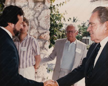 Sonny Vasquez shaking hands of Richard Nixon, Carl Lindner (center)